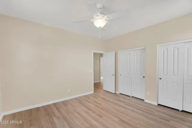 an aerial view of a house with a swimming pool patio and outdoor seating