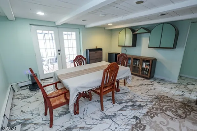 a dining room with furniture and window