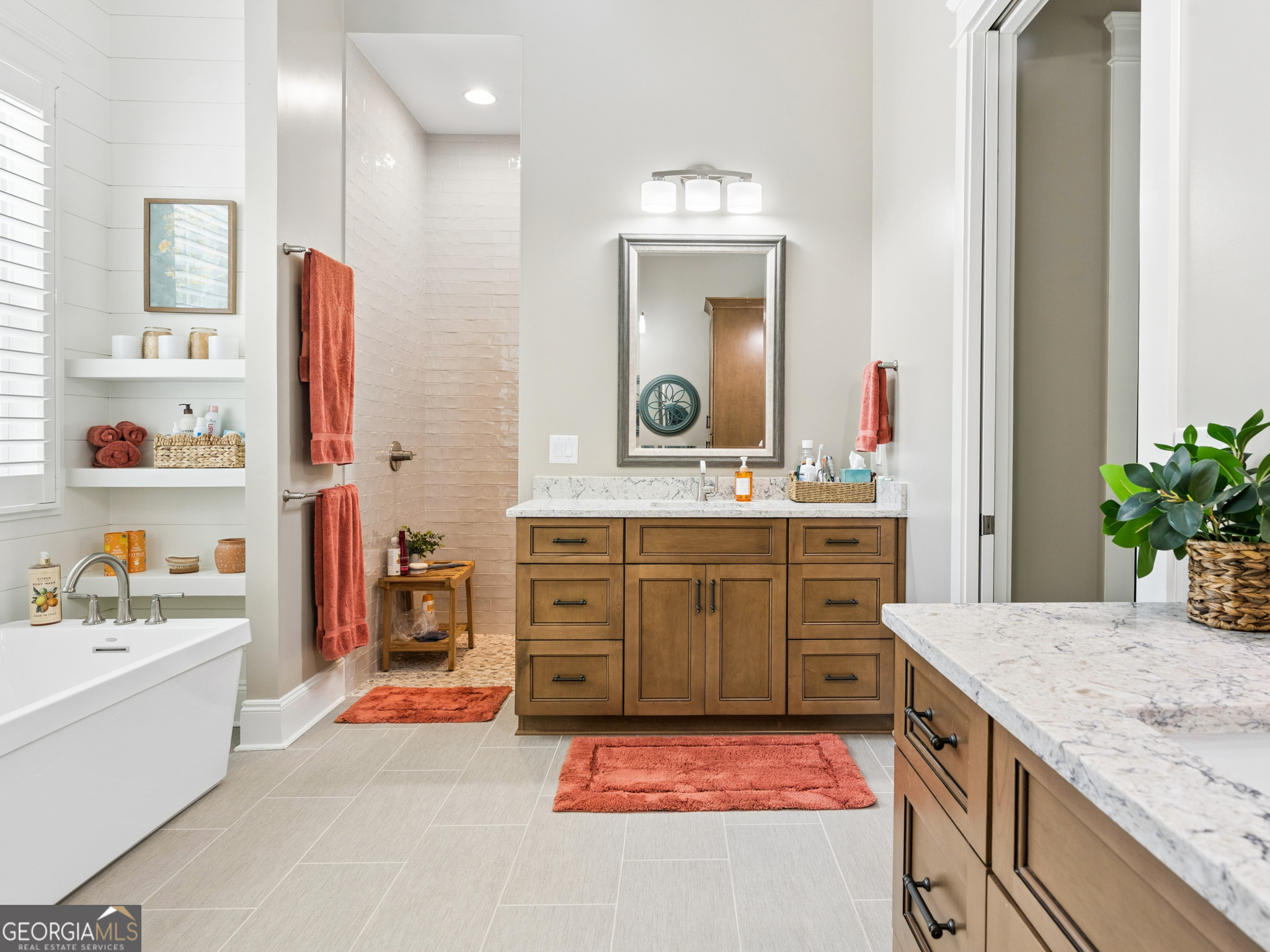 143 Carlota Way Hartwell, GA 30643 - Photo 16 of 48 a bathroom with a sink double vanity and a mirror