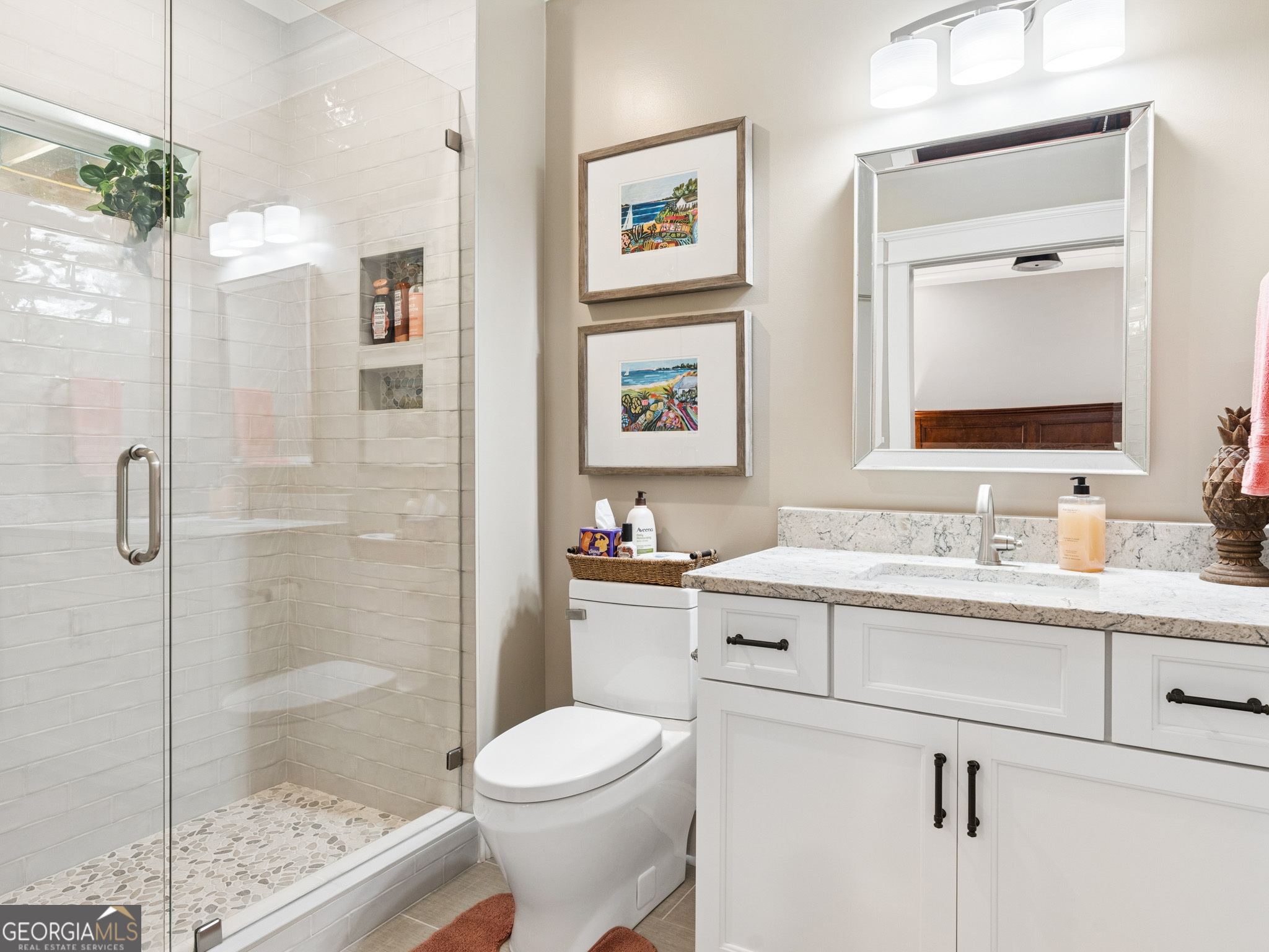 143 Carlota Way Hartwell, GA 30643 - Photo 28 of 48 a bathroom with a granite countertop sink mirror vanity and toilet