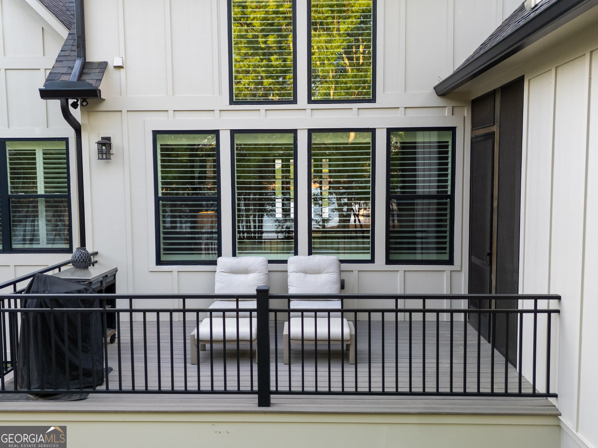 143 Carlota Way Hartwell, GA 30643 - Photo 34 of 48 a view of a balcony with two chairs and a barbeque