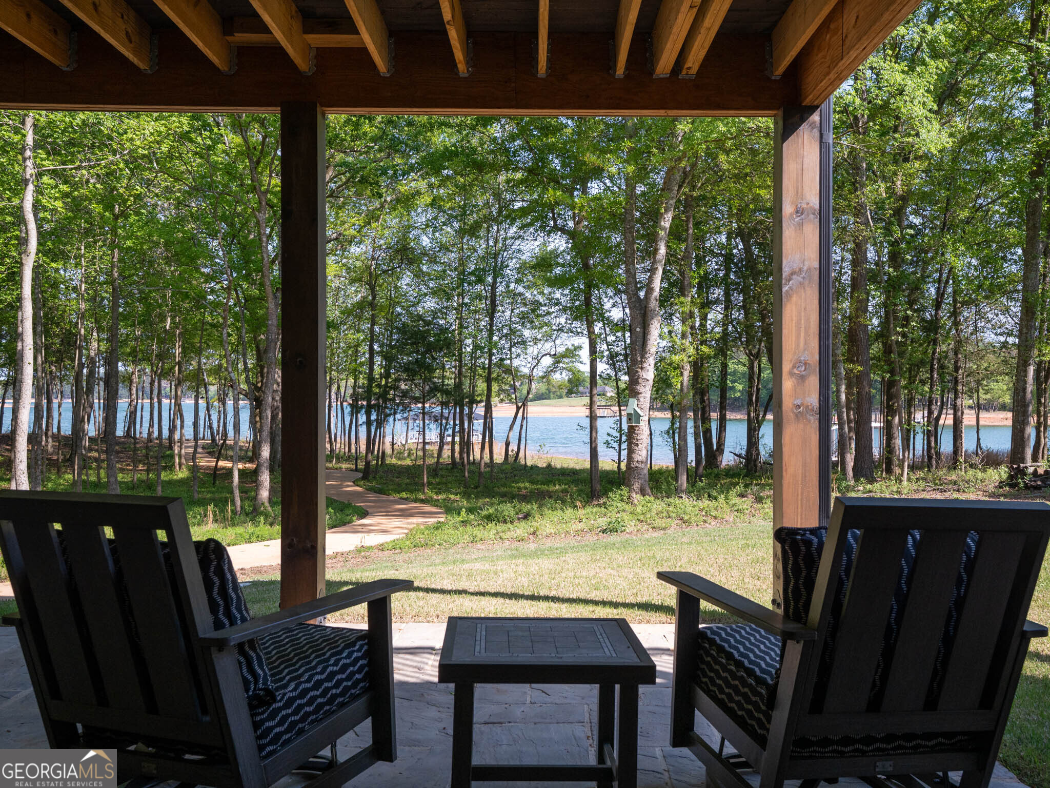 143 Carlota Way Hartwell, GA 30643 - Photo 39 of 48 a view of a patio with table and chairs potted plants and large tree