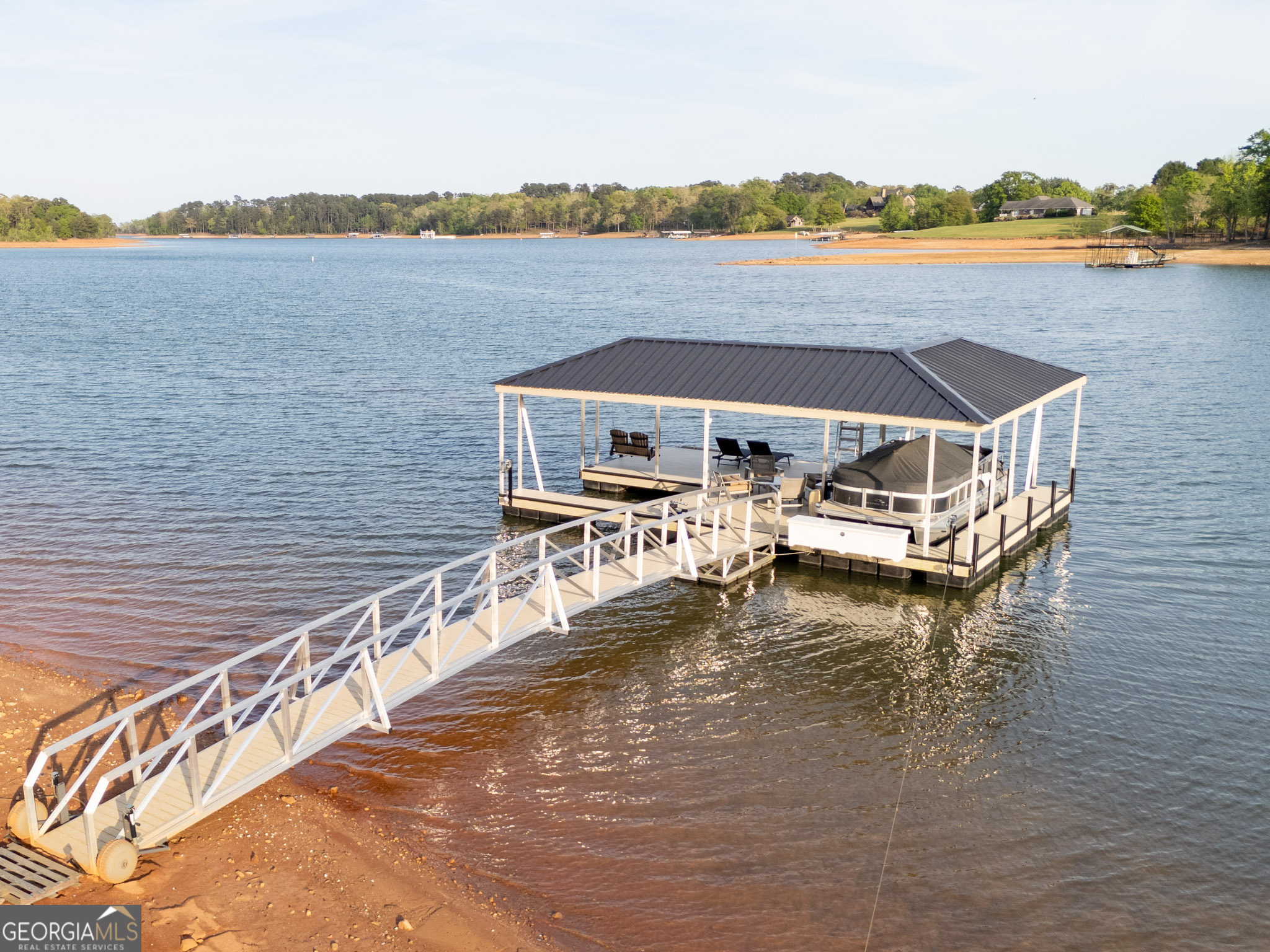 143 Carlota Way Hartwell, GA 30643 - Photo 47 of 48 a view of a lake with a terrace
