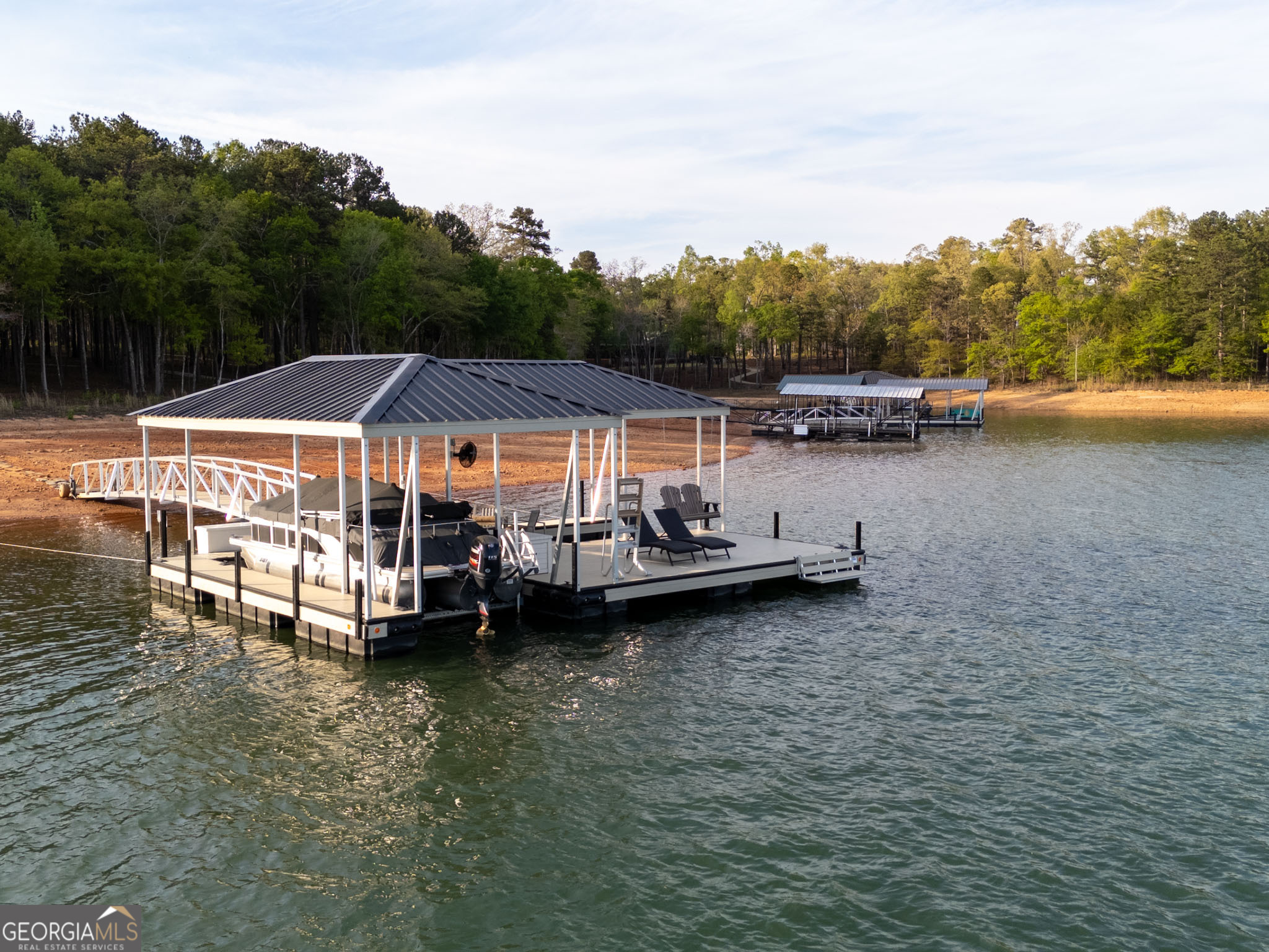 143 Carlota Way Hartwell, GA 30643 - Photo 5 of 48 a view of a house with sitting area and swimming pool