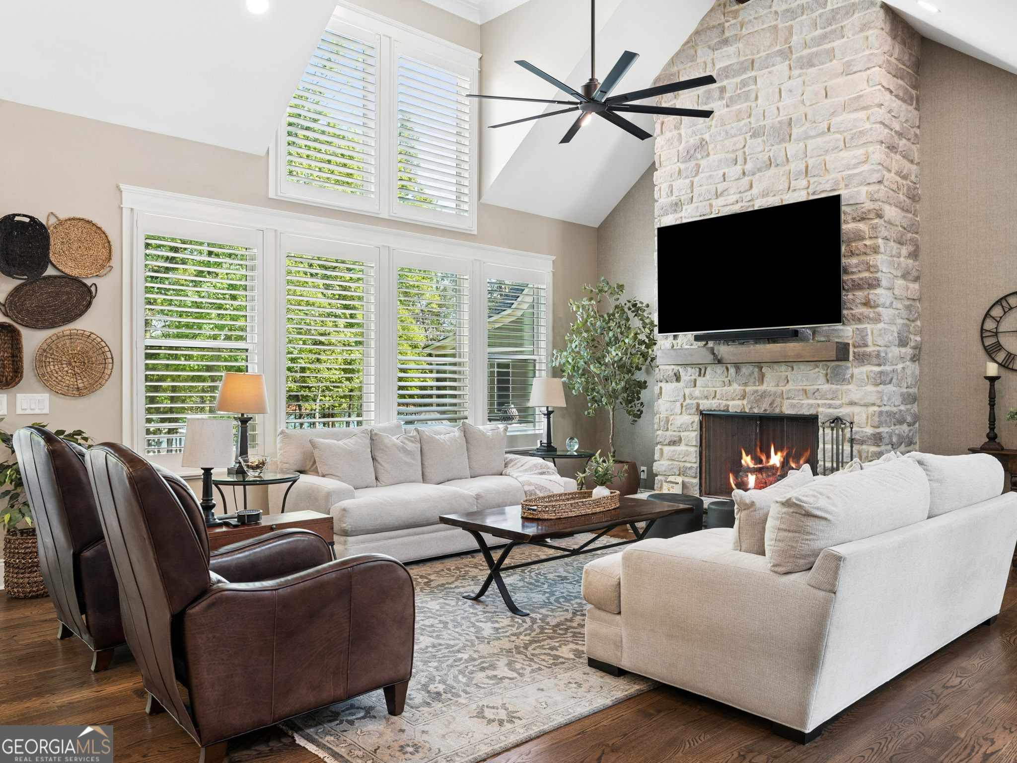 143 Carlota Way Hartwell, GA 30643 - Photo 9 of 48 a living room with furniture a flat screen tv and a fireplace