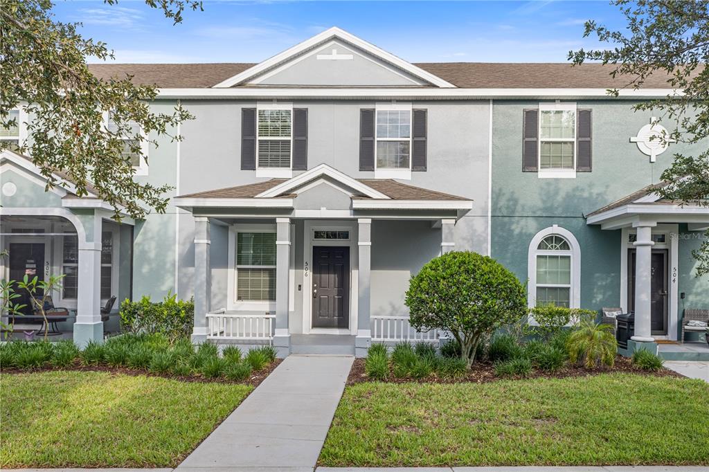 506 Rainbow Springs Loop Groveland, FL 34736 - Photo 1 of 30 a front view of a house with garden