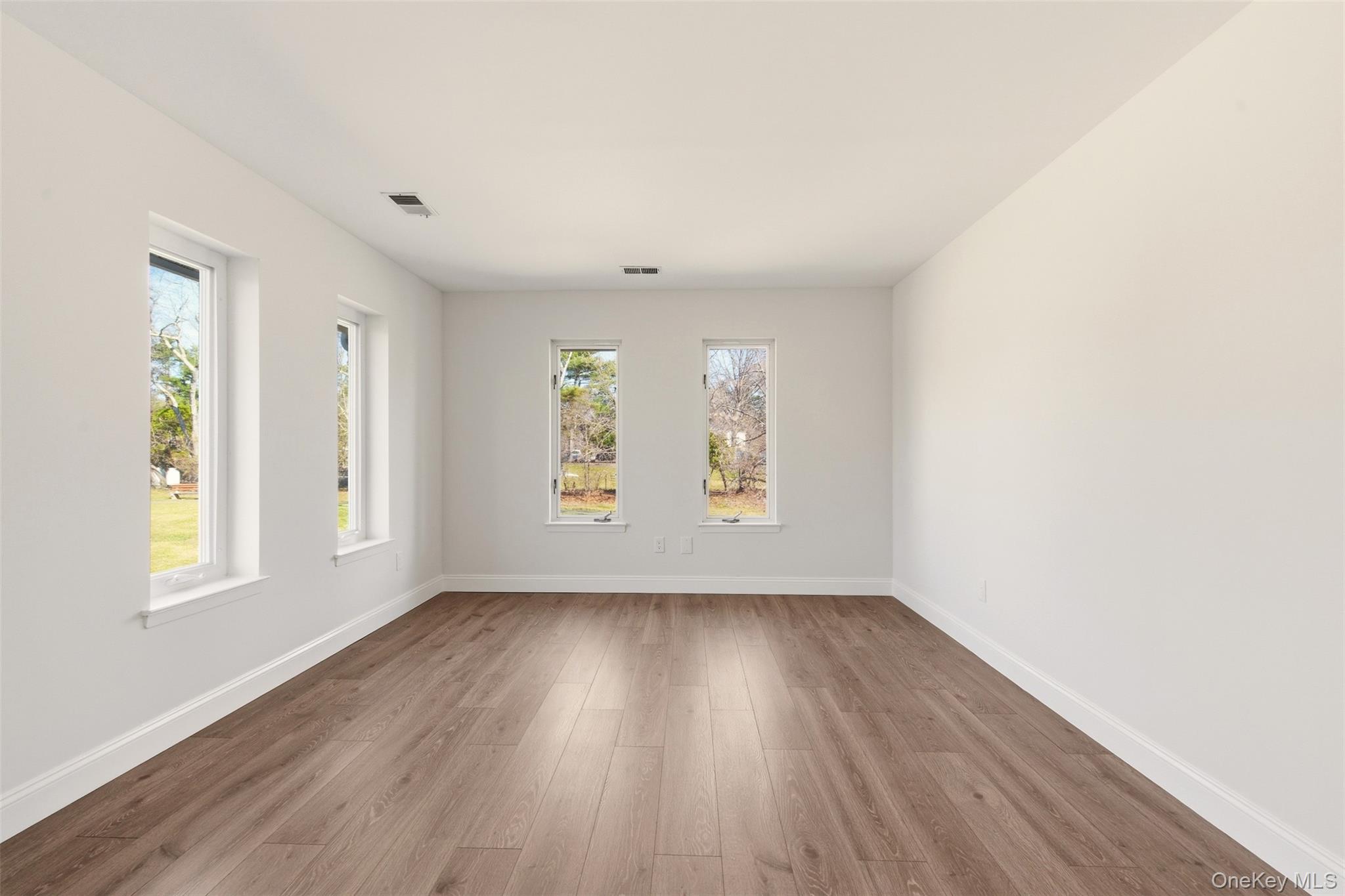 909 Fenway Road St. James, NY 11780 - Photo 17 of 34 Very Spacious Primary Bedroom with lots of windows.