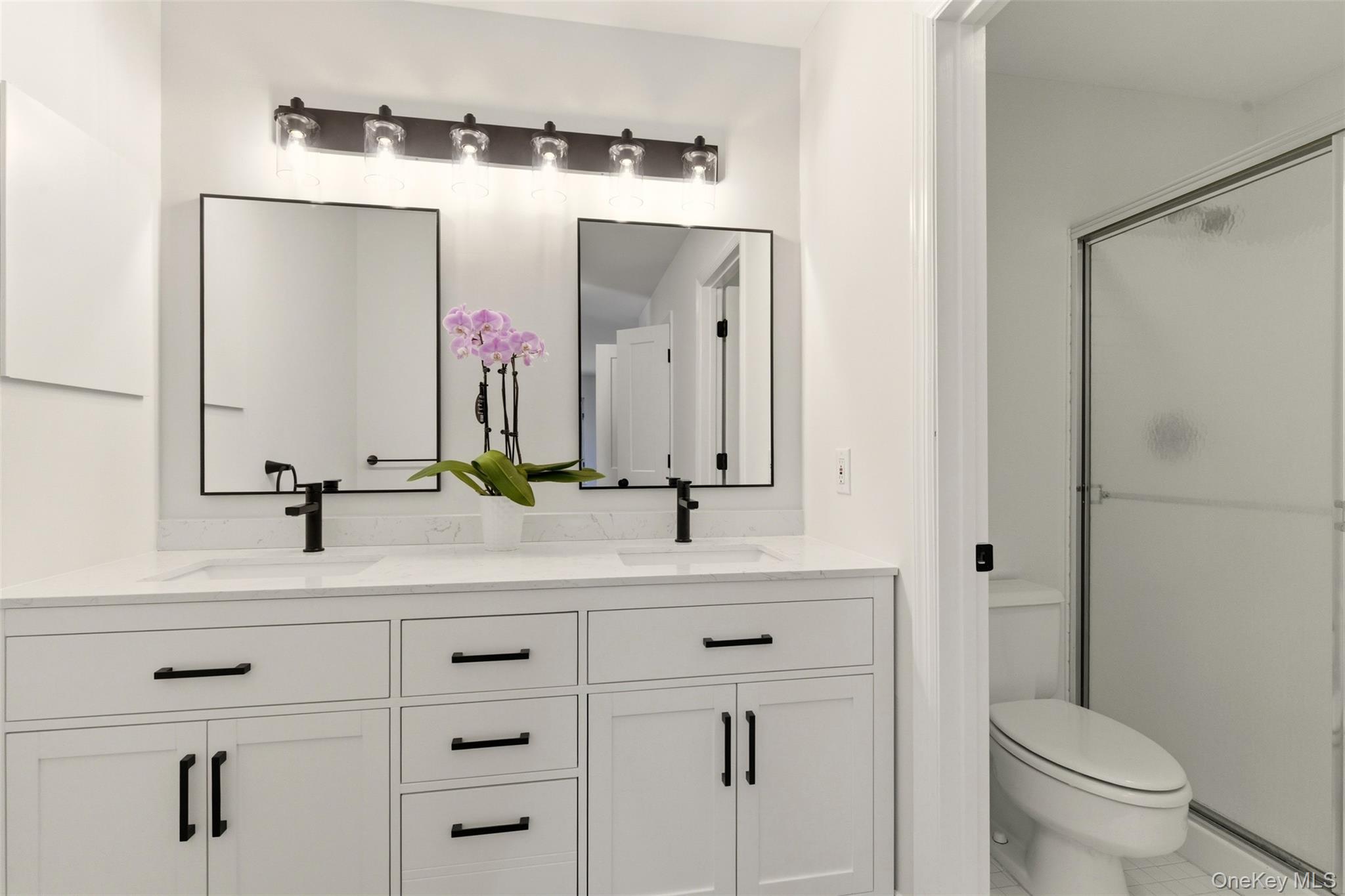 909 Fenway Road St. James, NY 11780 - Photo 22 of 34 Primary Bedroom Large Double Vanity & view of shower.