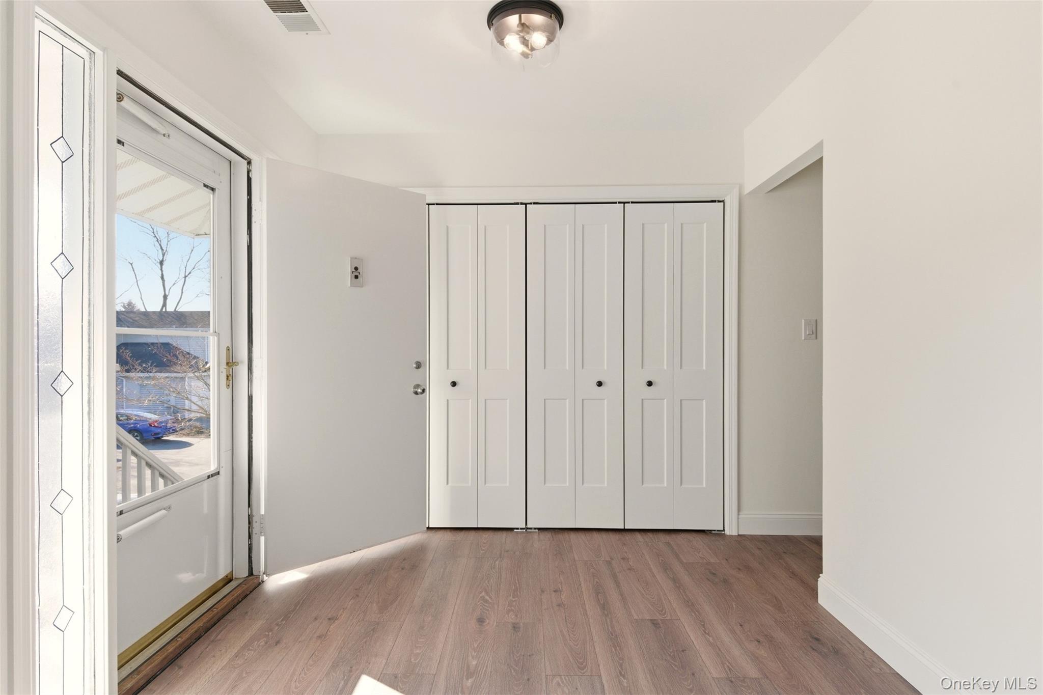 909 Fenway Road St. James, NY 11780 - Photo 5 of 34 Large Closet in Foyer Area. All new Wood Style Laminate Flooring.