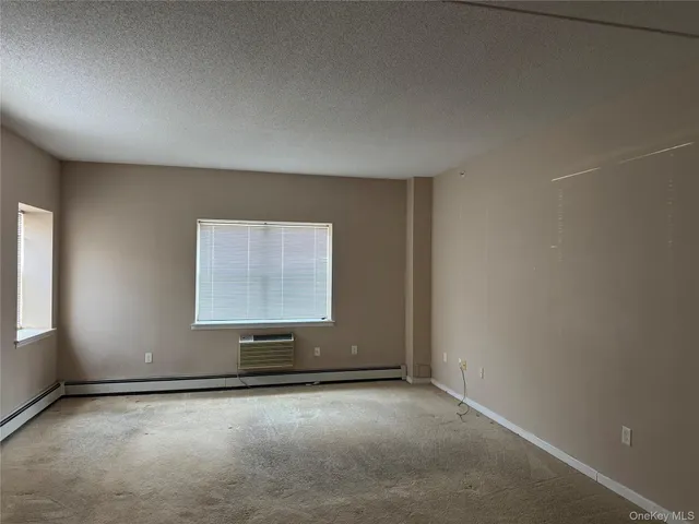 an empty room with a empty space and window