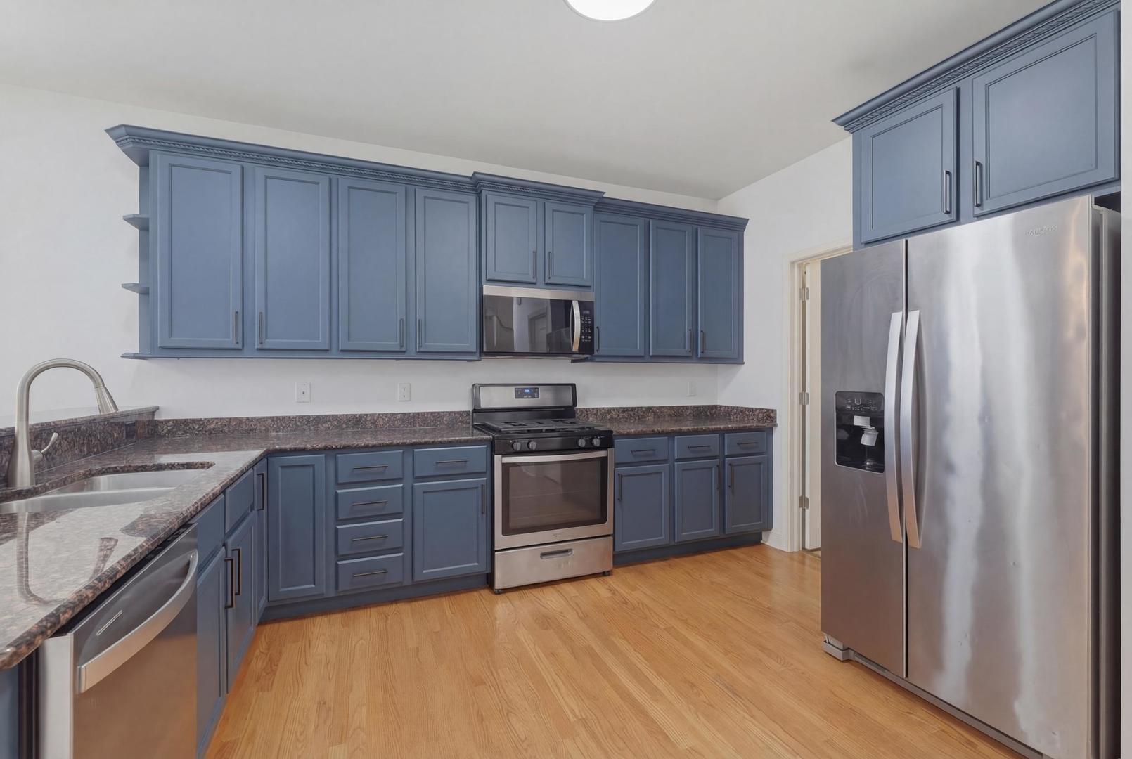 301 Nicole Way Itasca, IL 60143 - Photo 11 of 38 a kitchen with stainless steel appliances granite countertop a refrigerator stove and sink