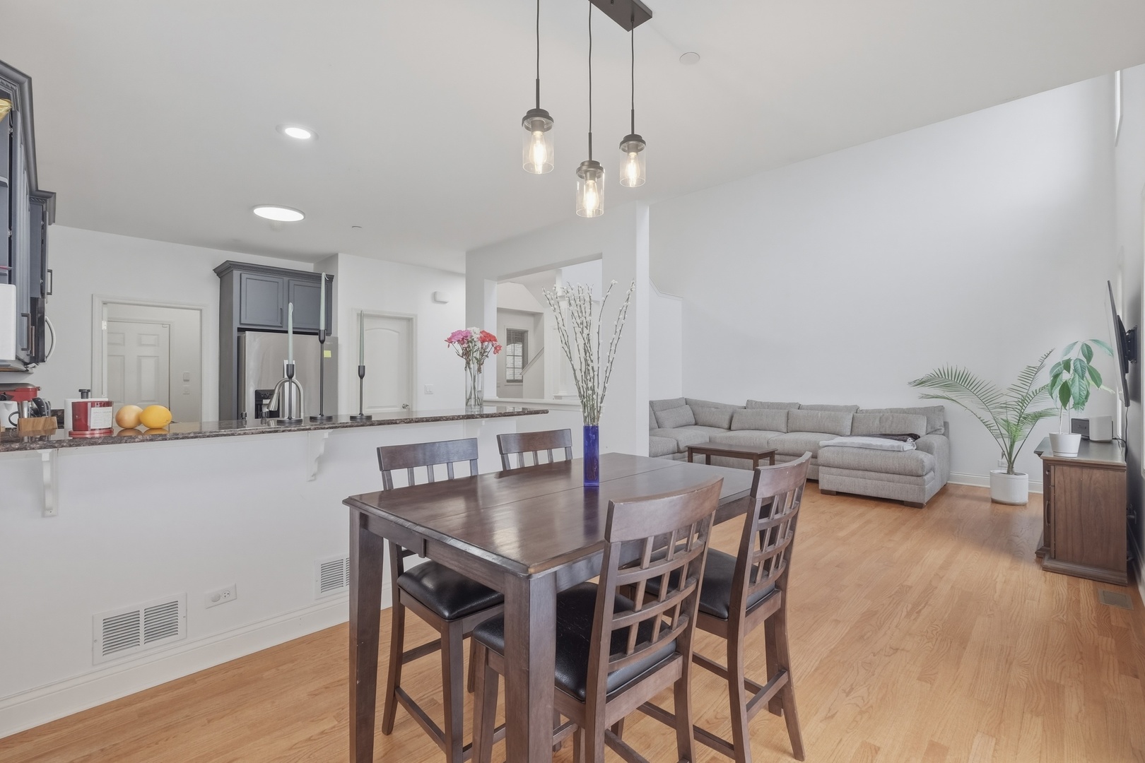 301 Nicole Way Itasca, IL 60143 - Photo 15 of 38 a view of a dining room with furniture and wooden floor