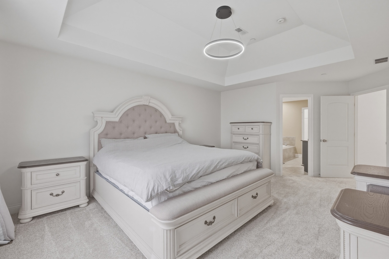 301 Nicole Way Itasca, IL 60143 - Photo 20 of 38 a spacious bedroom with a bed and a couch