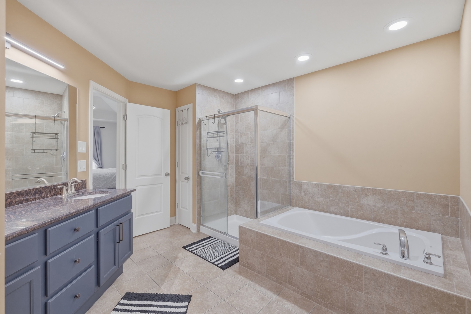 301 Nicole Way Itasca, IL 60143 - Photo 22 of 38 a spacious bathroom with a tub sink shower and mirror