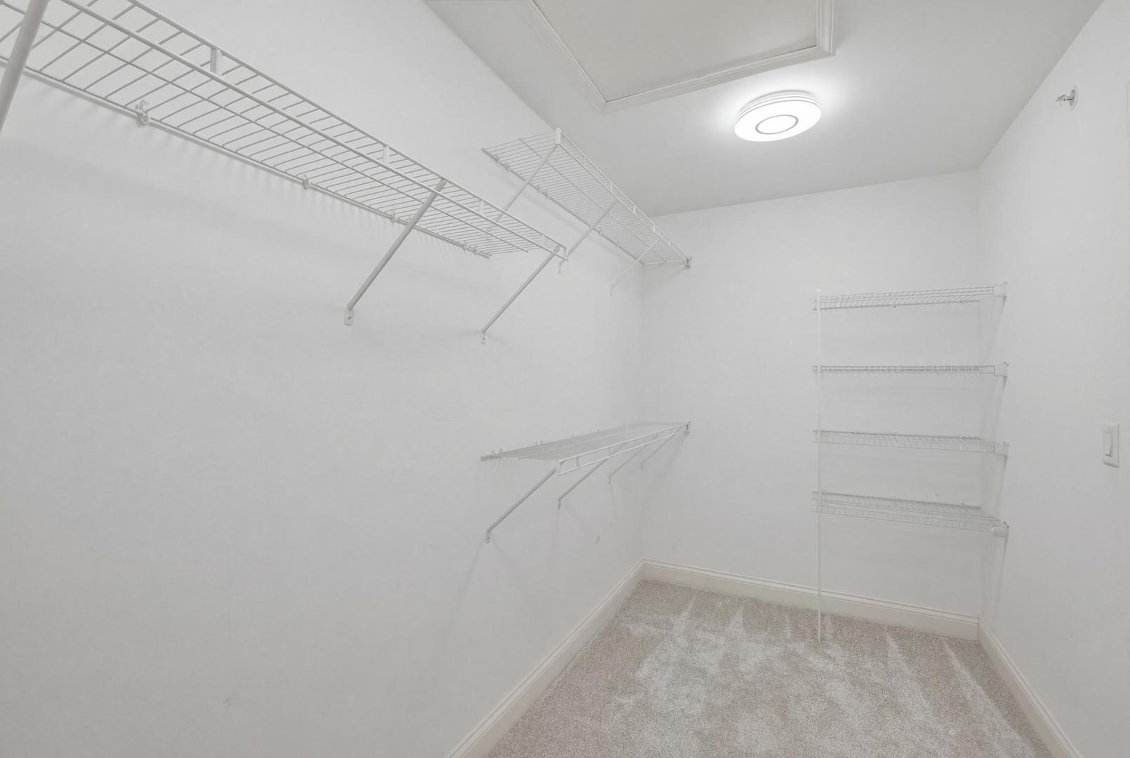 301 Nicole Way Itasca, IL 60143 - Photo 23 of 38 a view of a room with empty racks
