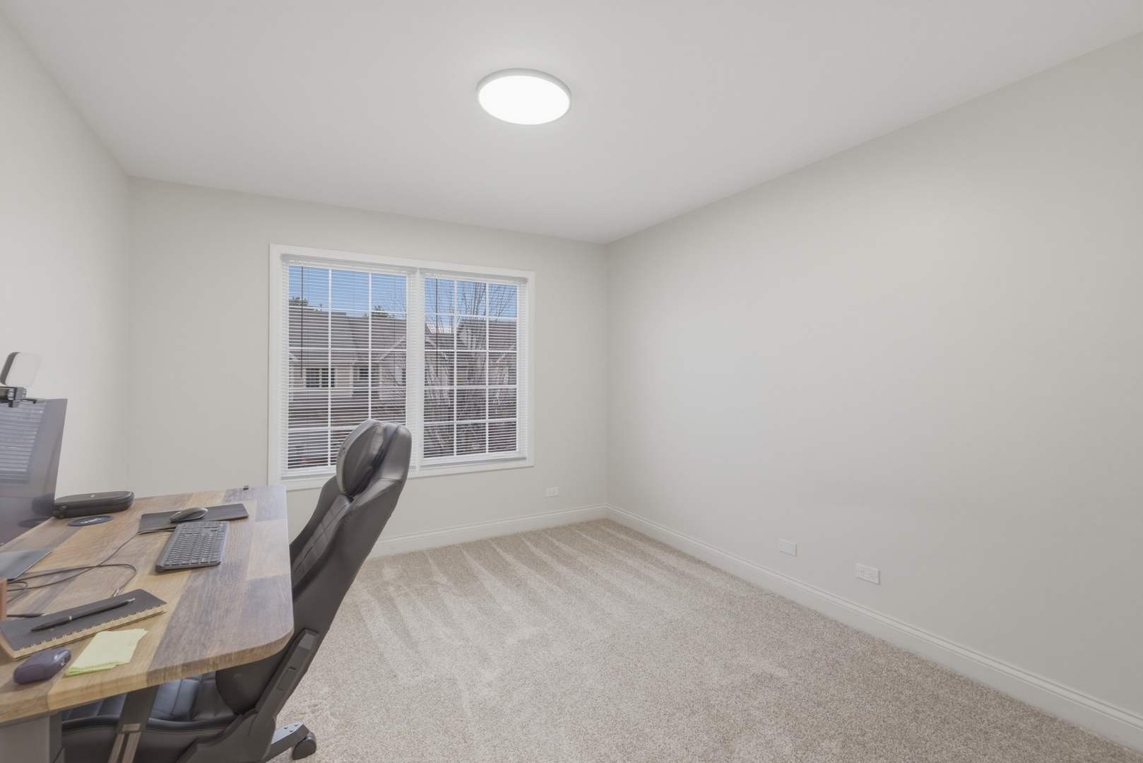 301 Nicole Way Itasca, IL 60143 - Photo 24 of 38 a view of a workspace with furniture and a window