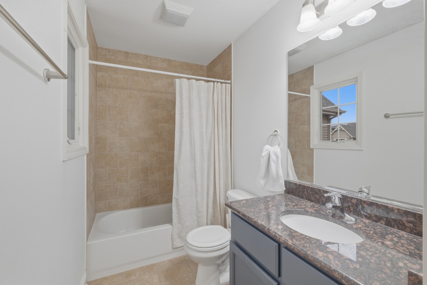 301 Nicole Way Itasca, IL 60143 - Photo 29 of 38 a bathroom with a granite countertop sink toilet and shower