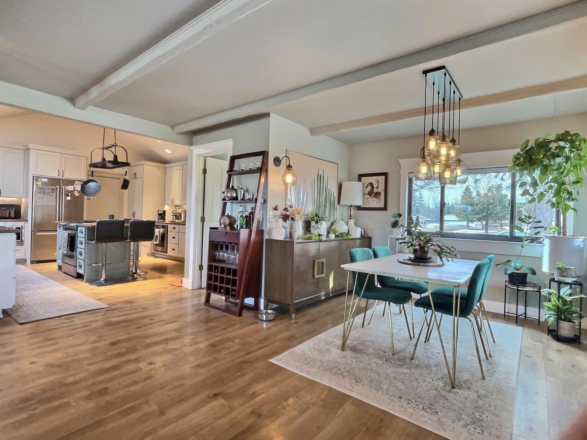 60360 Horse Butte Road Bend, OR 97702 - Photo 18 of 58 a view of a dining room with furniture window and wooden floor