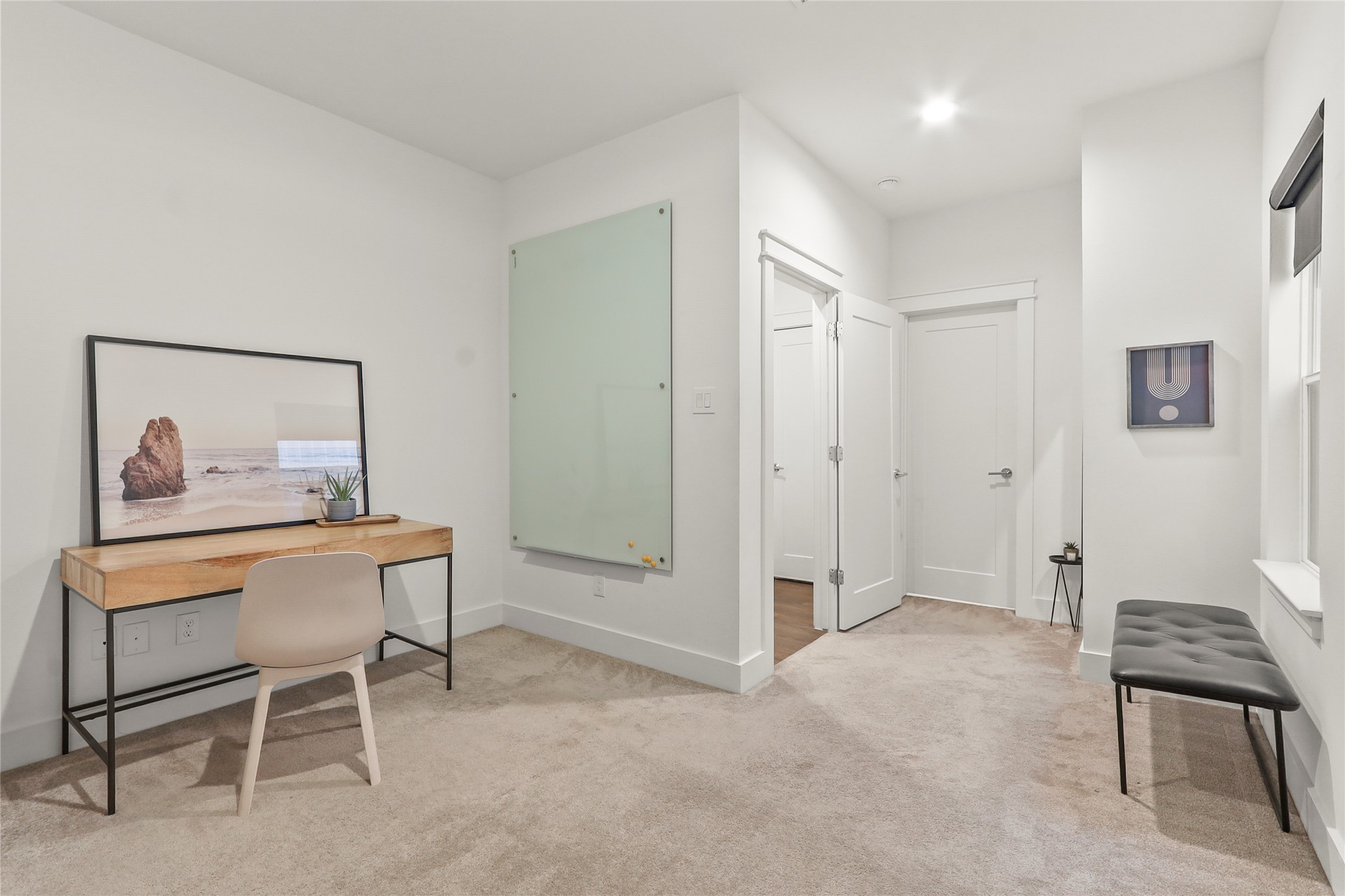 1141 West 17th Street, Unit A Houston, TX 77008 - Photo 16 of 18 Second bedroom or office featuring light carpet and baseboards. Full bathroom and closet attached.