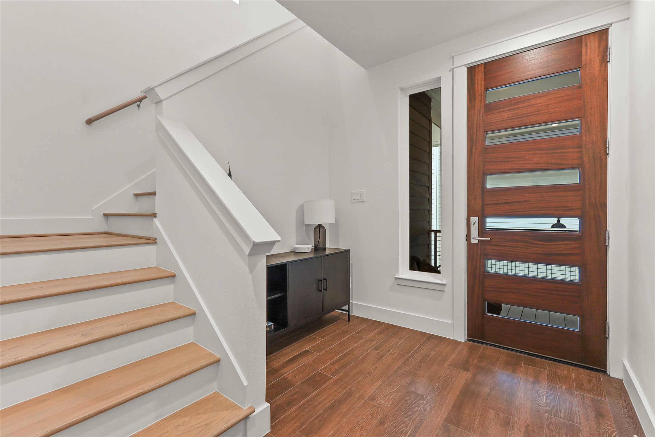 1141 West 17th Street, Unit A Houston, TX 77008 - Photo 2 of 18 Foyer featuring dark wood-style tile floors and stairs