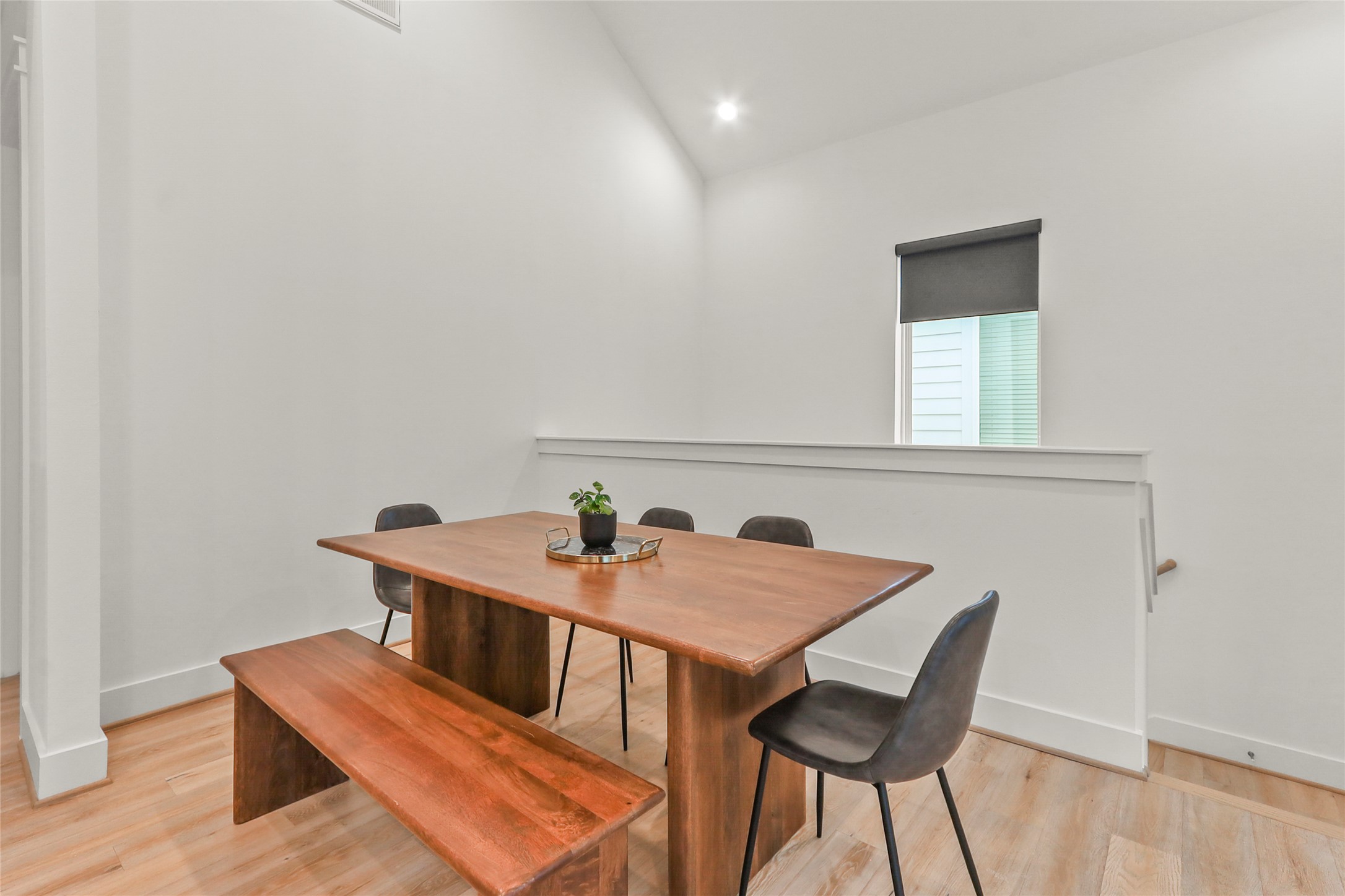 1141 West 17th Street, Unit A Houston, TX 77008 - Photo 8 of 18 Dining space with light wood-style flooring, lofted ceiling, and recessed lighting