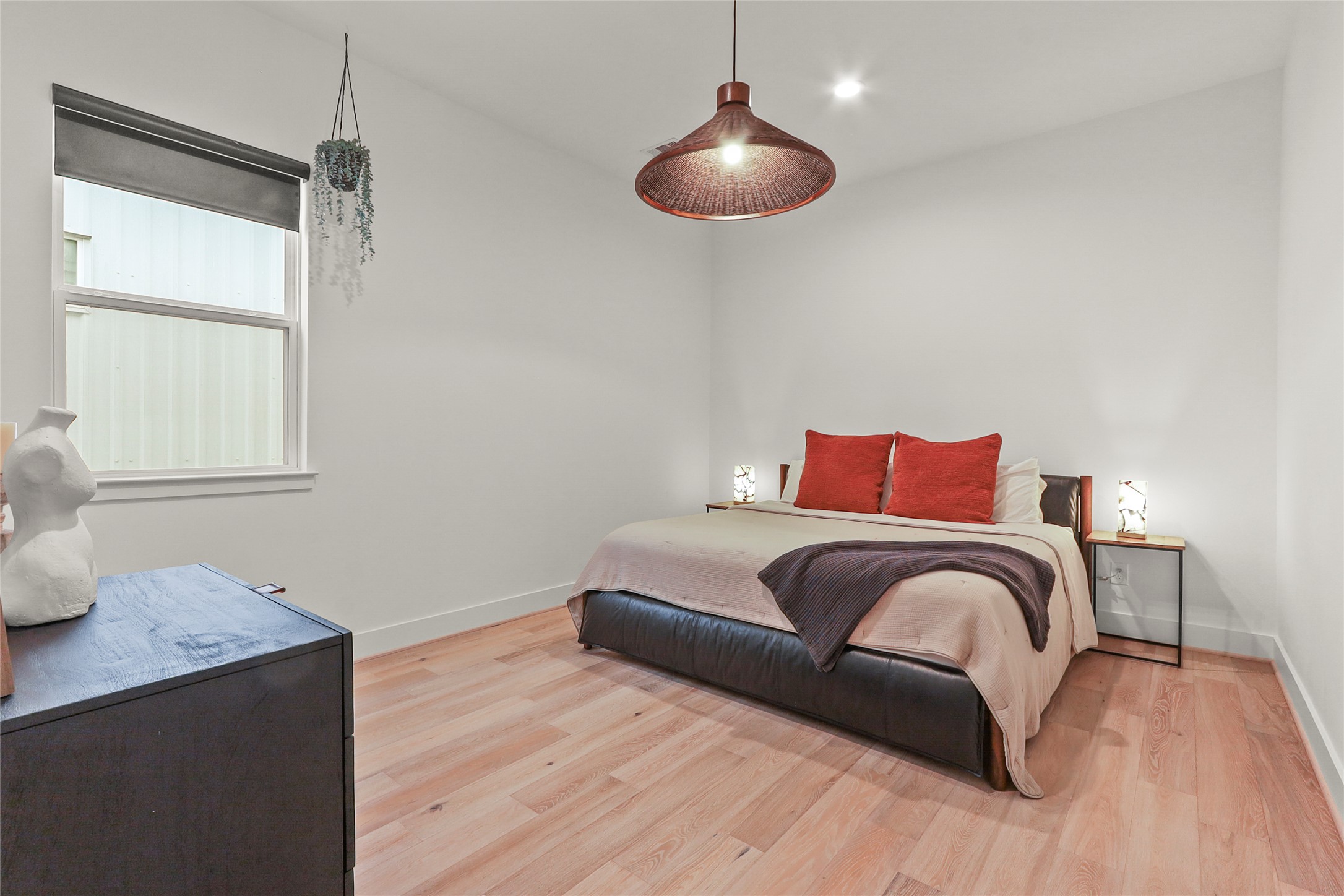 1141 West 17th Street, Unit A Houston, TX 77008 - Photo 10 of 18 Bedroom featuring light wood-style floors and recessed lighting