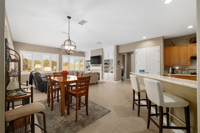 a view of a dining room with furniture window and outside view
