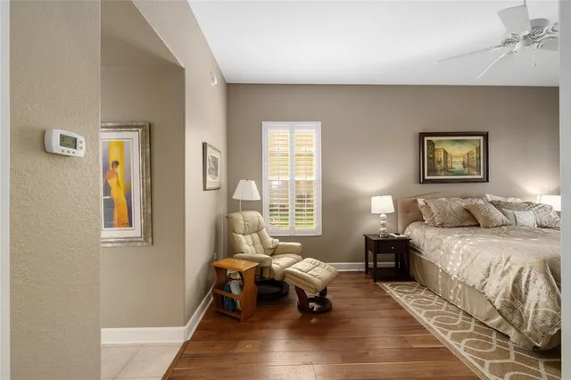 a spacious bedroom with a bed and a couch