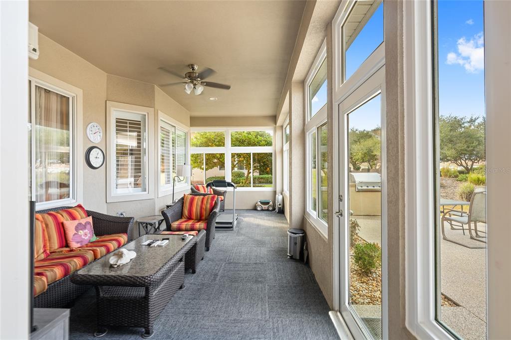 9479 Southeast 130th Street Road Summerfield, FL 34491 - Photo 36 of 67 a living room with furniture and a large window
