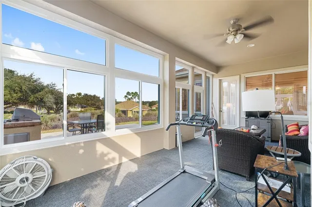 a view of a house with swimming pool and porch with furniture