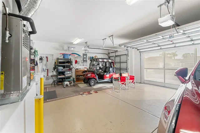 a front view of a house with yard patio and lake view