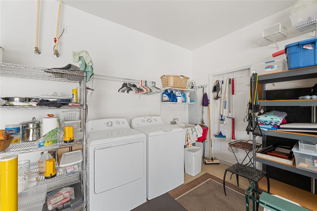 9479 Southeast 130th Street Road Summerfield, FL 34491 - Photo 40 of 67 a storage room with storage and utility