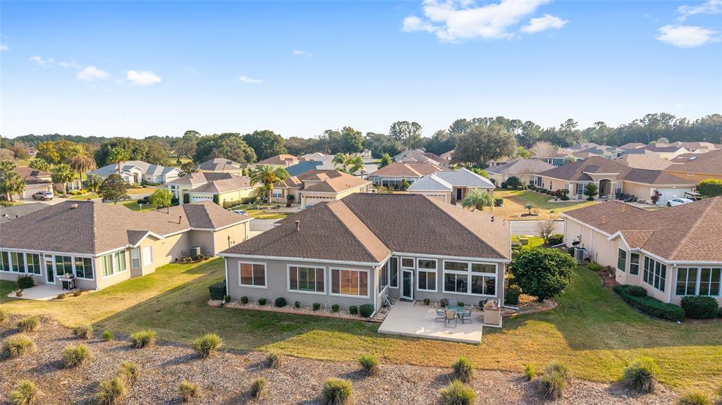 9479 Southeast 130th Street Road Summerfield, FL 34491 - Photo 45 of 67 an aerial view of residential houses with yard