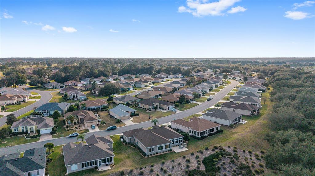 9479 Southeast 130th Street Road Summerfield, FL 34491 - Photo 48 of 67 an aerial view of residential houses with outdoor space