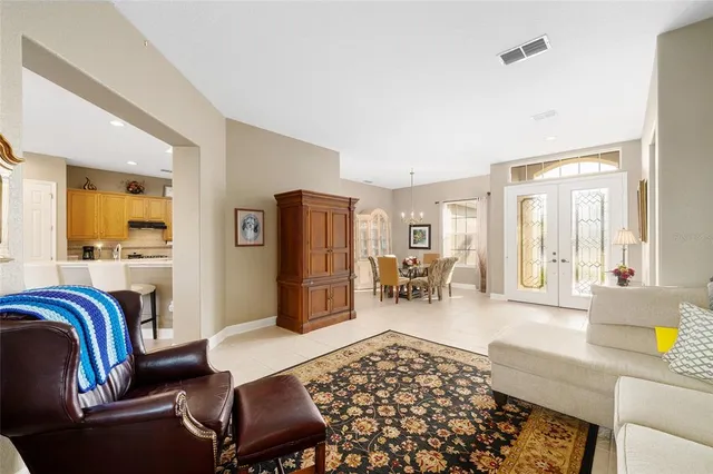 a living room with furniture rug and a table