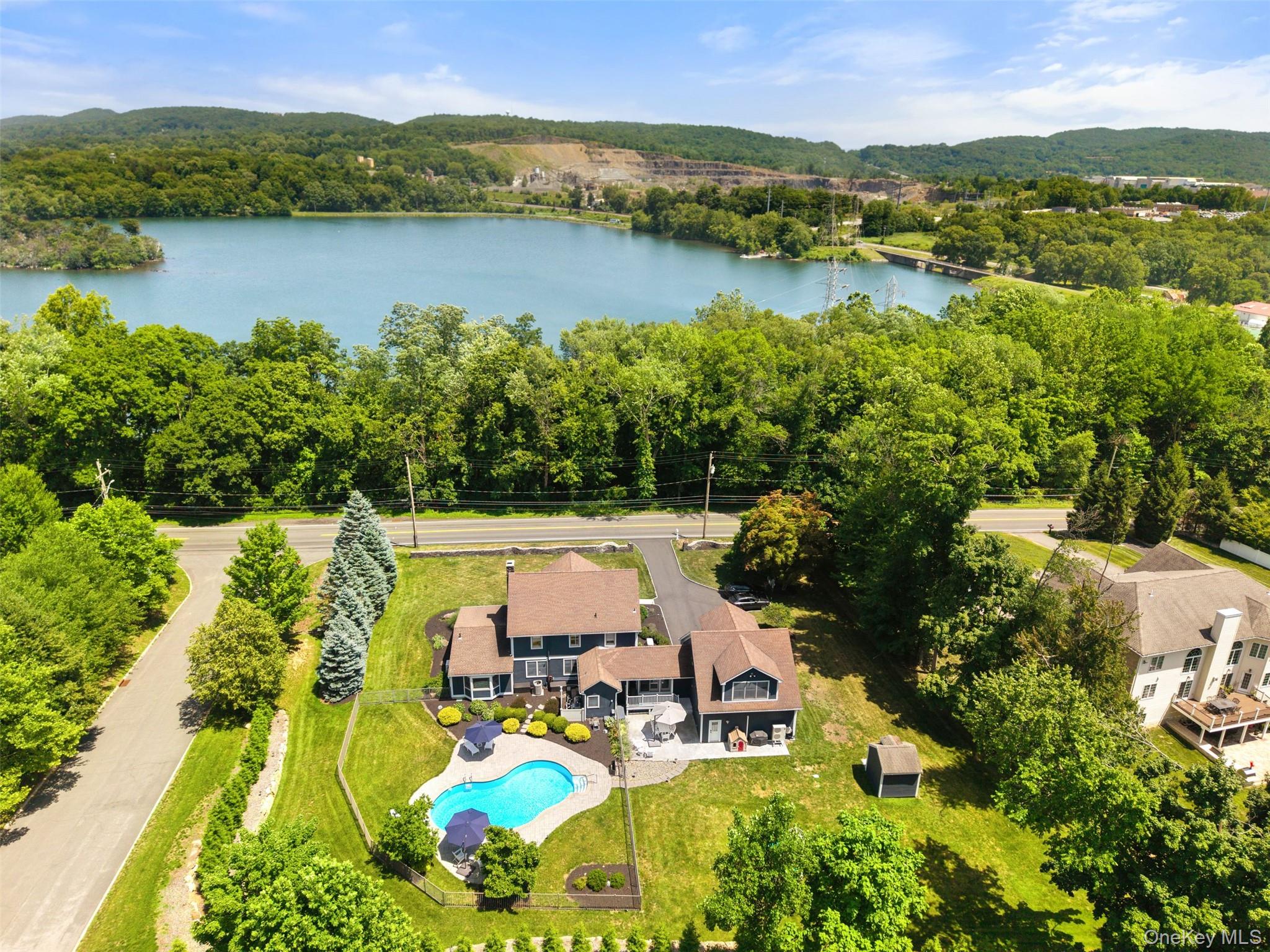 211 Strawtown Road West Nyack, NY 10994 - Photo 1 of 47 Welcome to 211 Strawtown Road in West Nyack with seasonal lake views.
