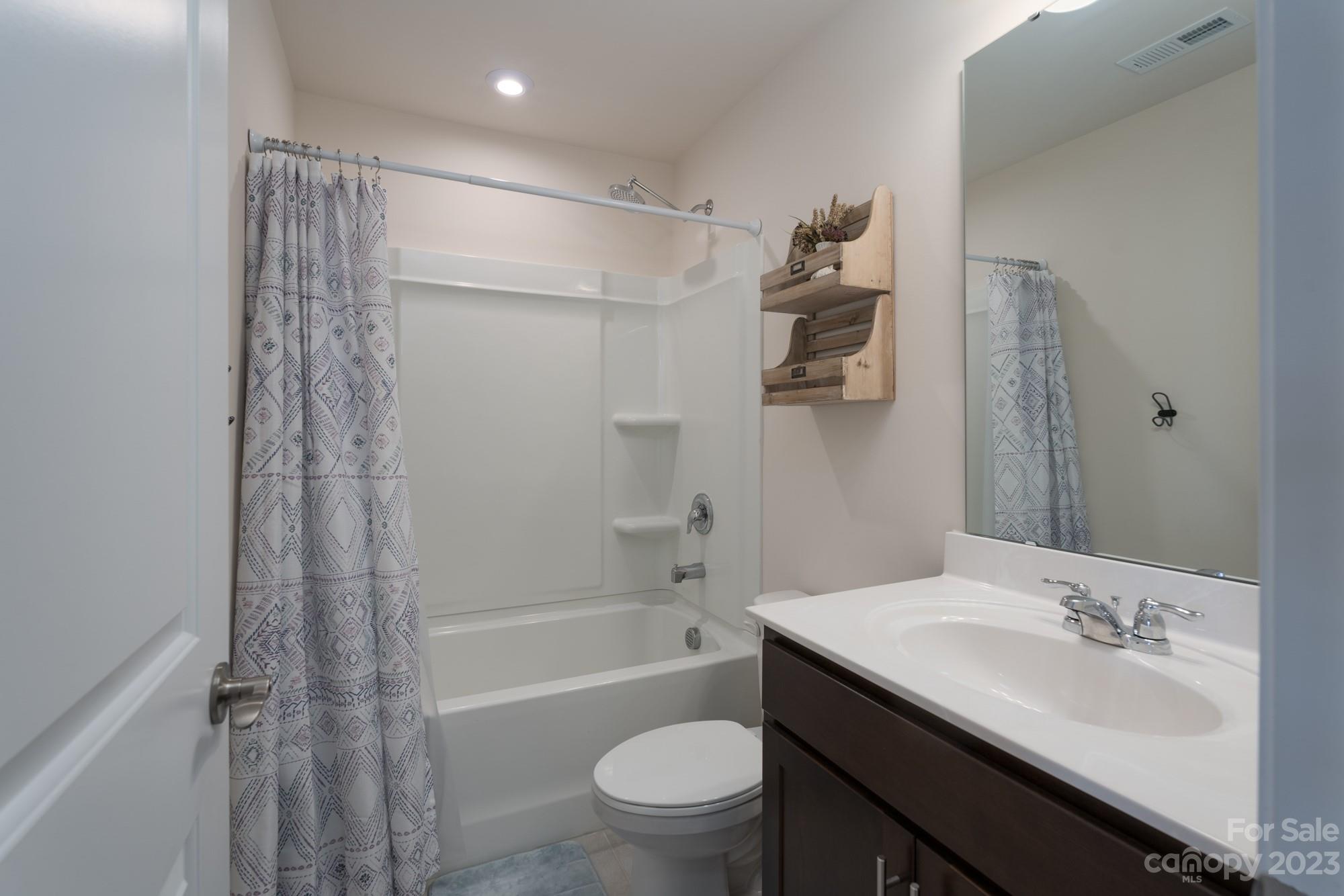467 Hunters Dance Road Fort Mill, SC 29708 - Photo 16 of 28 a bathroom with a sink a toilet and shower