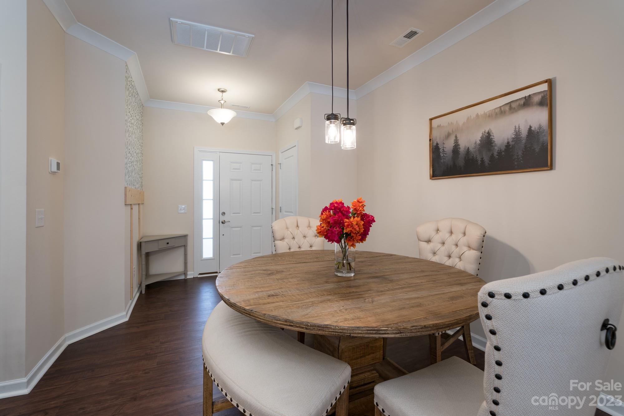 467 Hunters Dance Road Fort Mill, SC 29708 - Photo 4 of 28 a view of a dining room with furniture and wooden floor