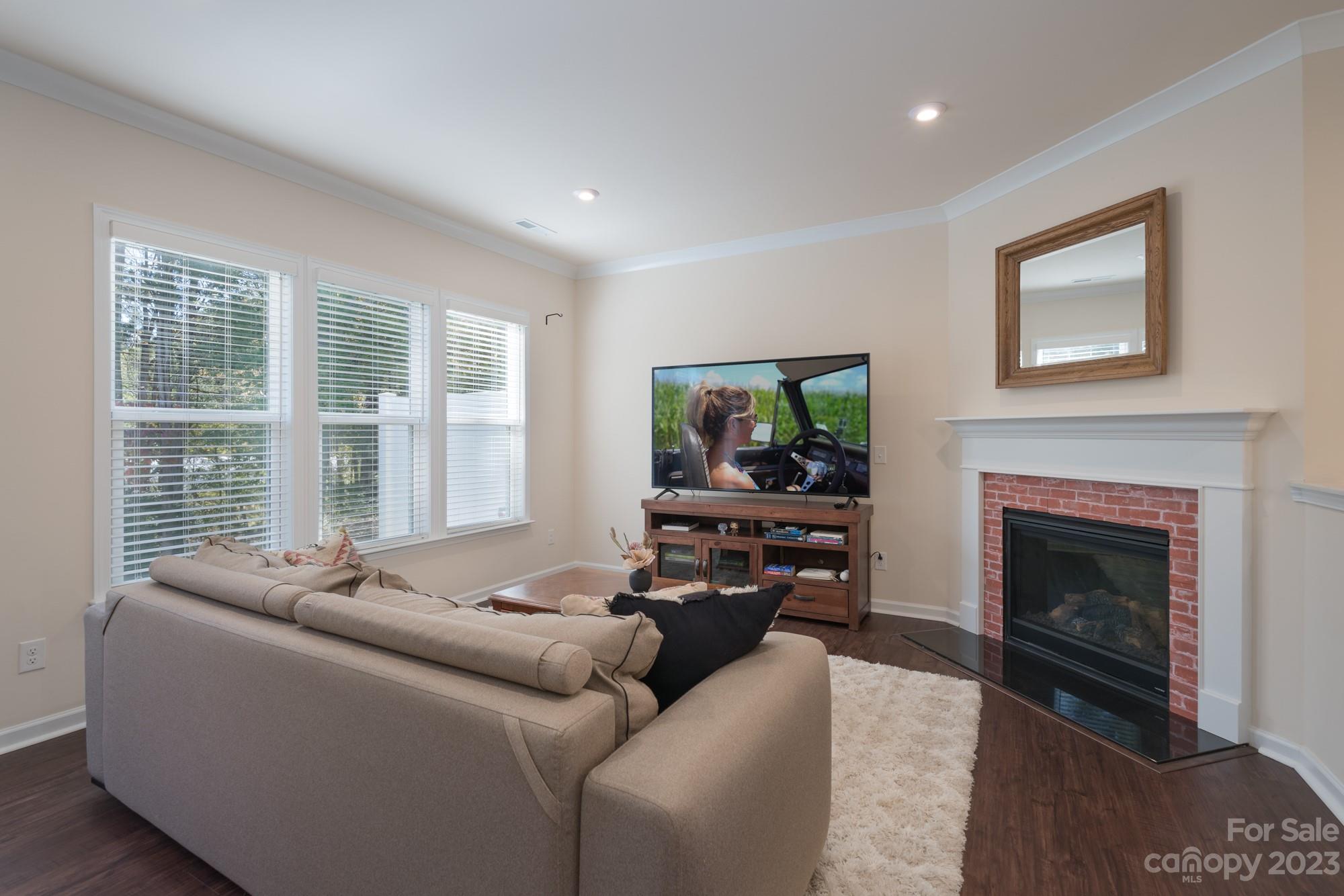 467 Hunters Dance Road Fort Mill, SC 29708 - Photo 8 of 28 a living room with furniture and a fireplace