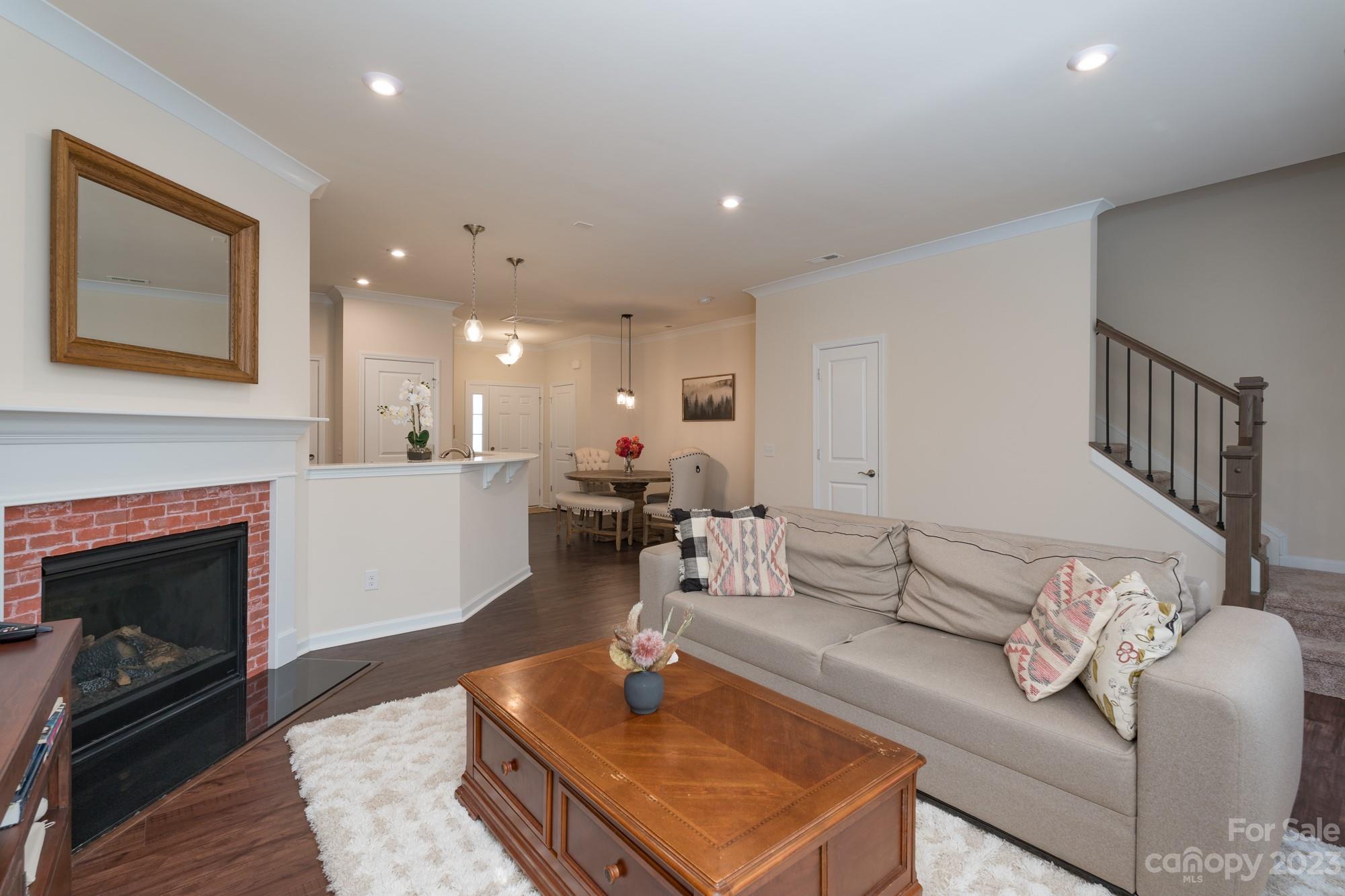 467 Hunters Dance Road Fort Mill, SC 29708 - Photo 9 of 28 a living room with furniture and a fireplace