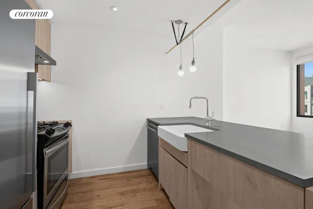 a utility room with sink dryer and washer
