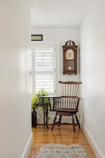 a workspace room with furniture and a window