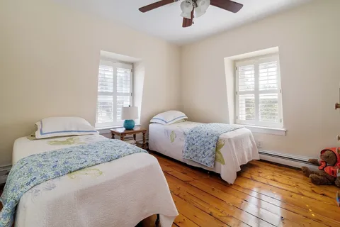 a view of an entryway with wooden floor