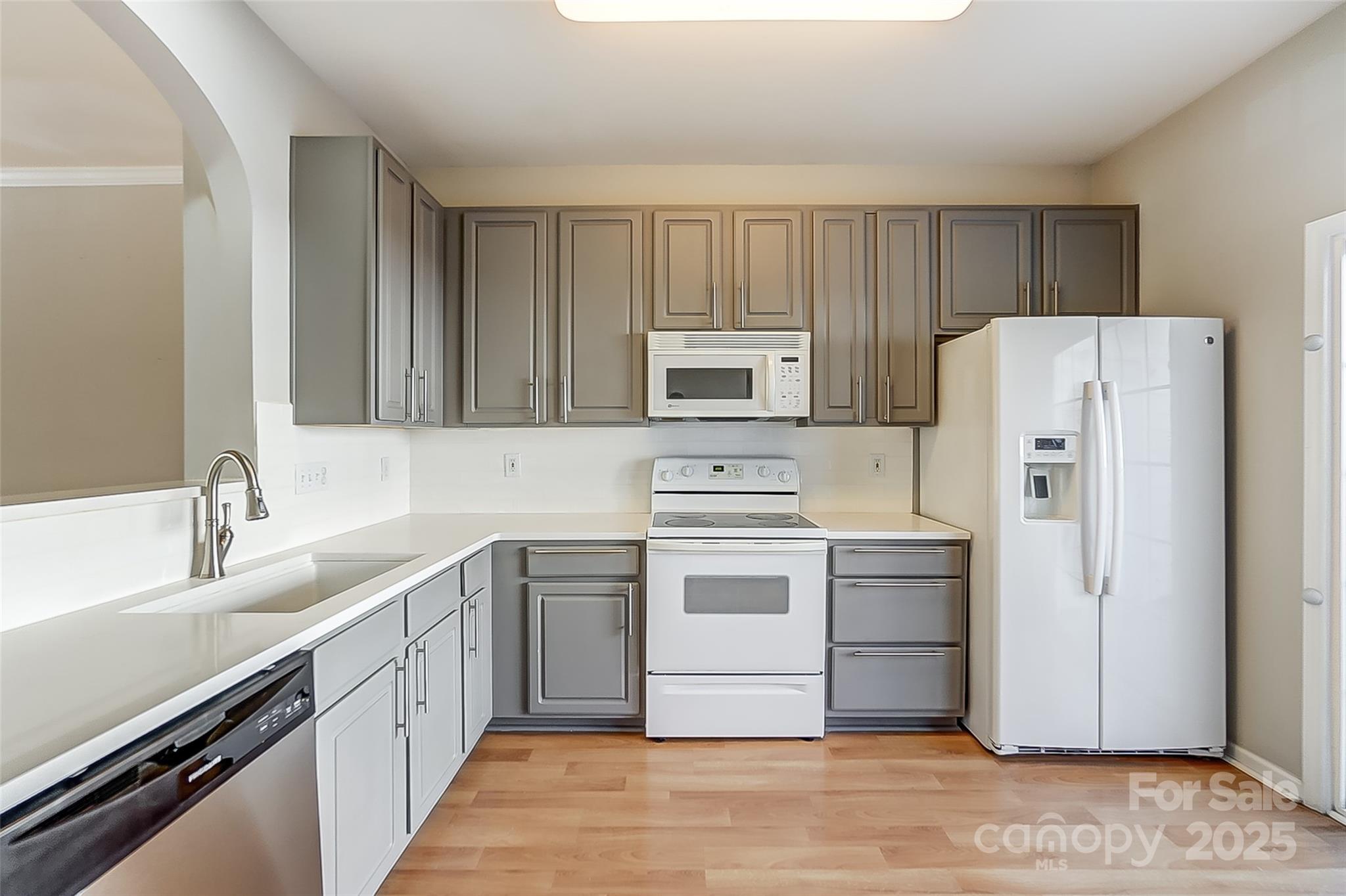 928 Azurine Circle Fort Mill, SC 29708 - Photo 11 of 33 a kitchen with a sink cabinets stainless steel appliances and a window