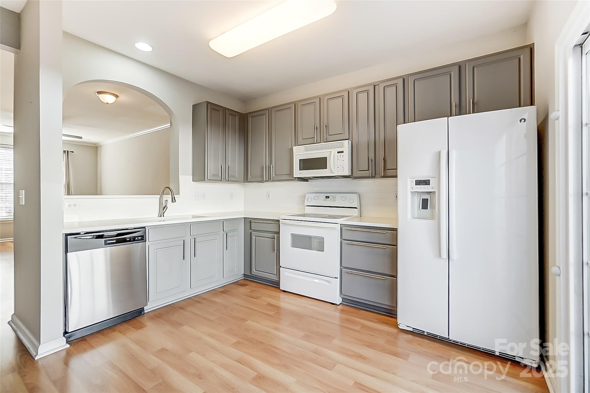 928 Azurine Circle Fort Mill, SC 29708 - Photo 12 of 33 a kitchen with white cabinets and white appliances