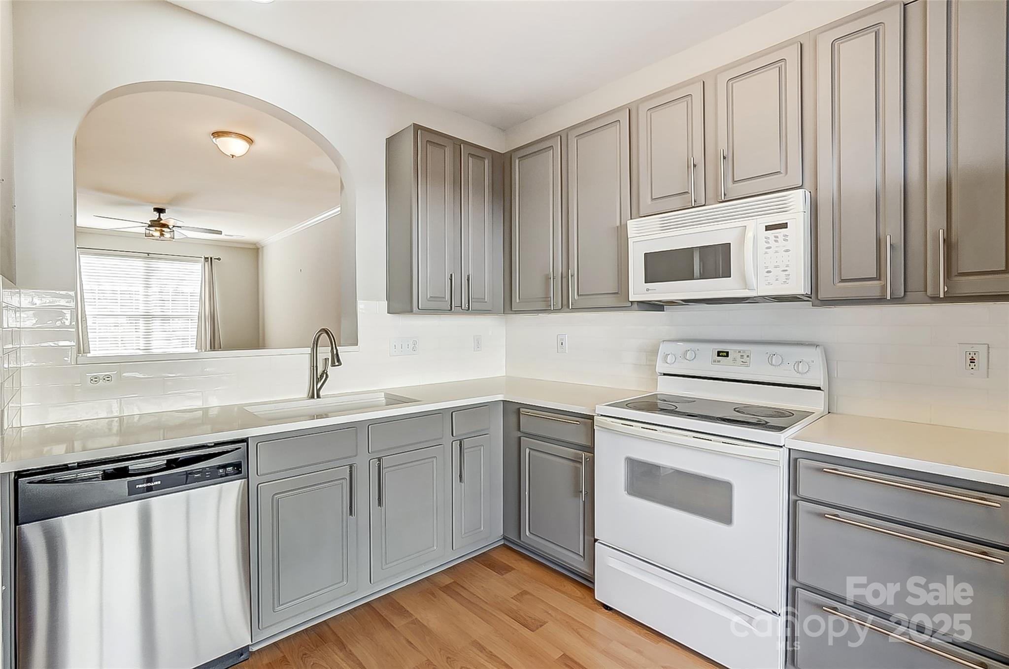 928 Azurine Circle Fort Mill, SC 29708 - Photo 13 of 33 a kitchen with cabinets appliances a sink and a counter top space