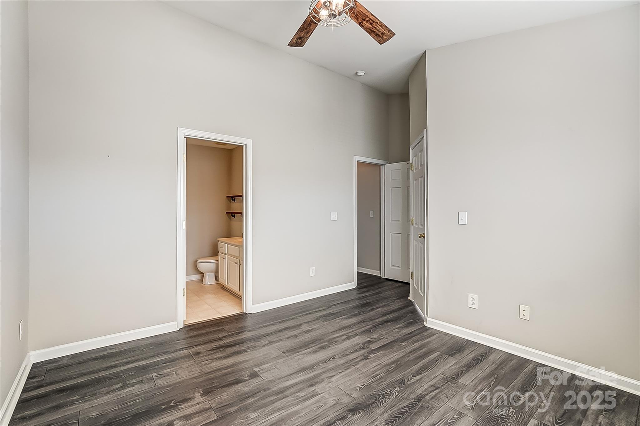 928 Azurine Circle Fort Mill, SC 29708 - Photo 24 of 33 an empty room with wooden floor and a ceiling fan