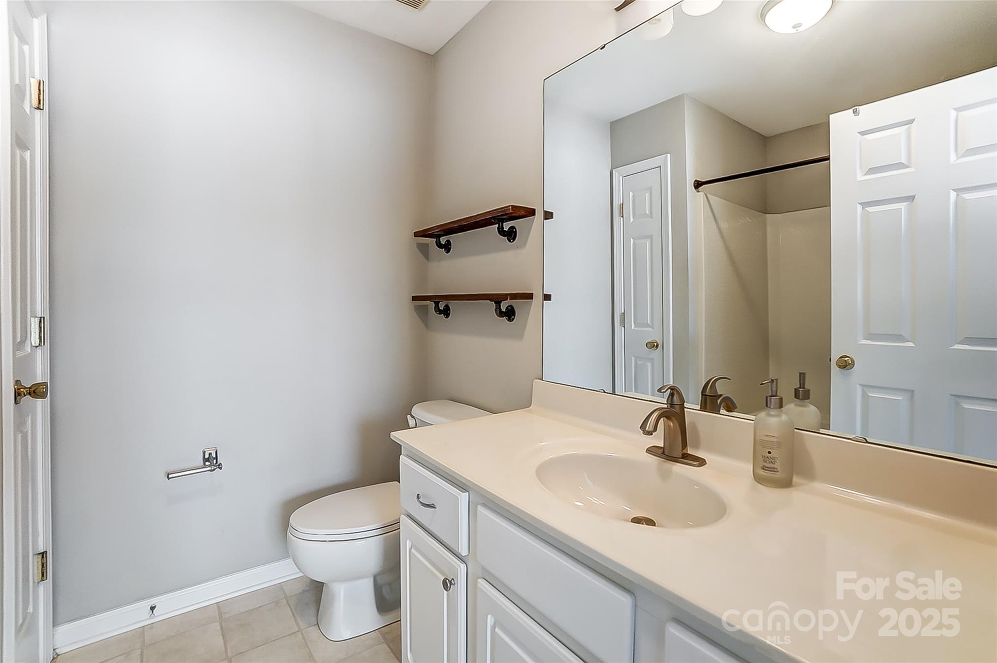 928 Azurine Circle Fort Mill, SC 29708 - Photo 26 of 33 a bathroom with a sink toilet and shower