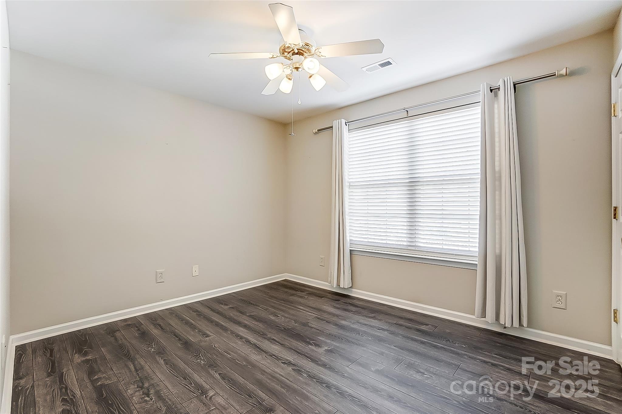 928 Azurine Circle Fort Mill, SC 29708 - Photo 29 of 33 wooden floor in an empty room with a window