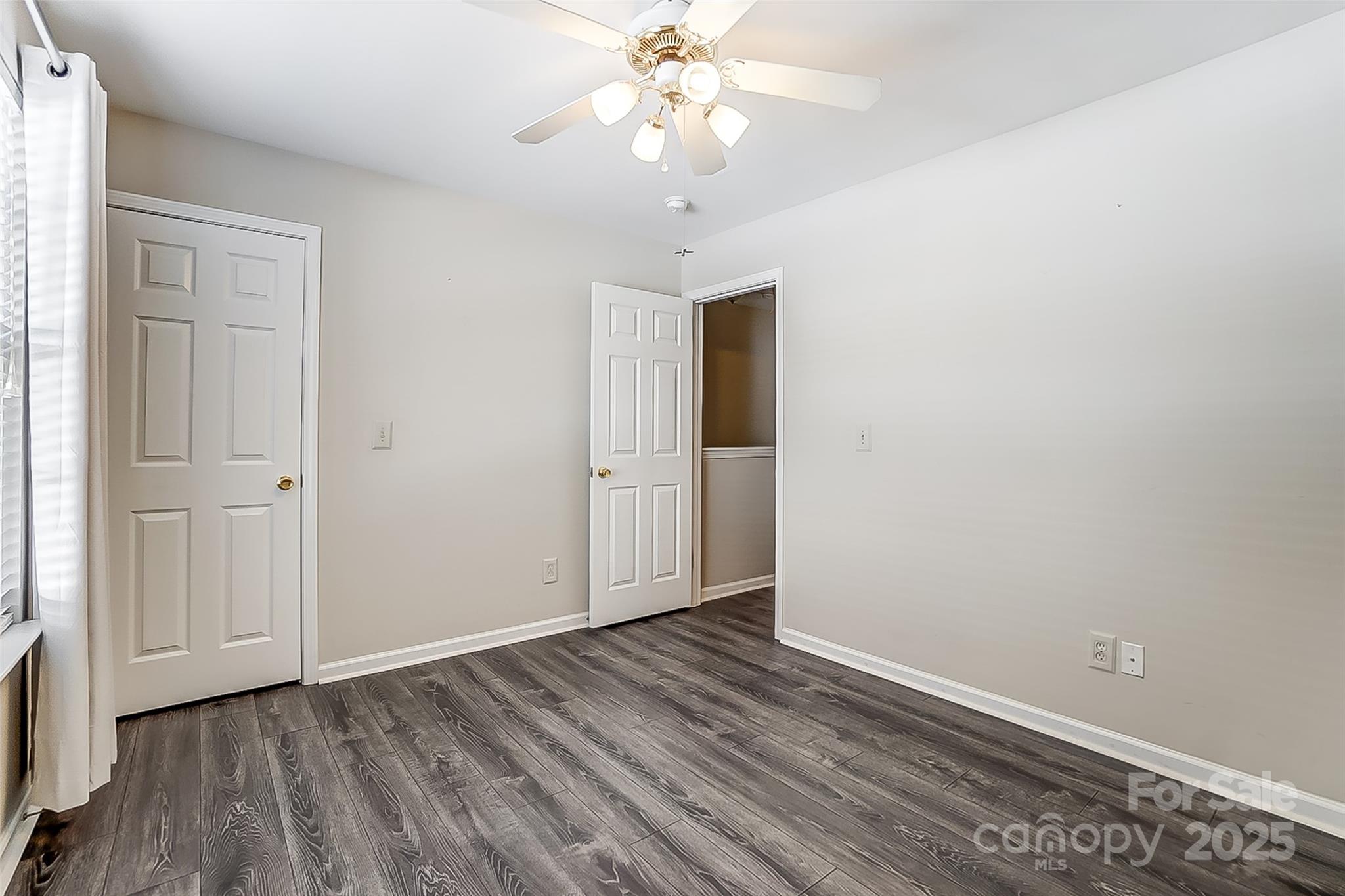 928 Azurine Circle Fort Mill, SC 29708 - Photo 31 of 33 wooden floor in an empty room with a window